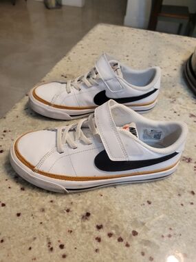 Nike Kids' White & Black Low Top Sneakers with Gold Accent